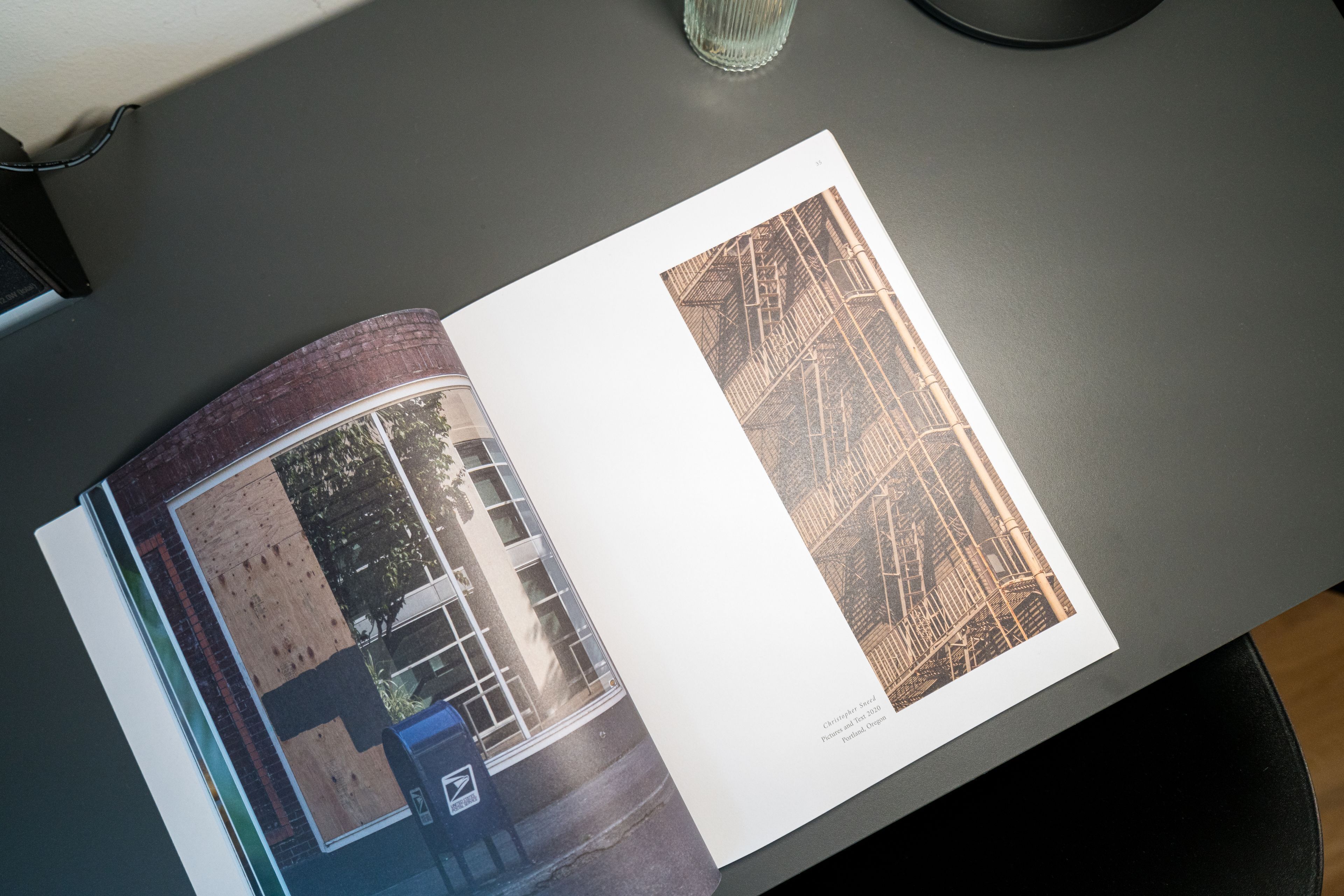 An open magazine with two pages displaying architectural photographs.