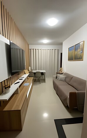Appartement Deluxe | Coin séjour | Télévision à écran plat