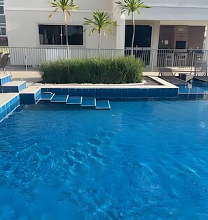 Deluxe Apartment | Pool | Indoor pool, open 9:00 AM to 10:00 PM, pool umbrellas, sun loungers