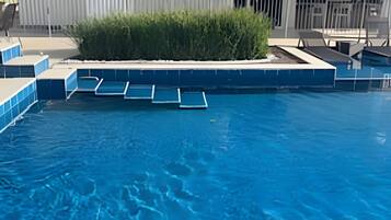 Deluxe Apartment | Pool | Indoor pool, open 9:00 AM to 10:00 PM, pool umbrellas, sun loungers