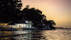 A waterfront property with a gazebo, a covered patio, and a house with a porch. - LillyBelleMar,San San Port Antonio,with pristine views and world class amenities (Fairy Hill)