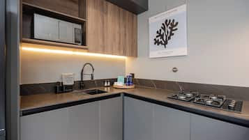 Fridge, microwave, stovetop, coffee/tea maker