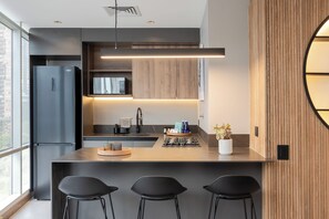 Fridge, microwave, stovetop, coffee/tea maker