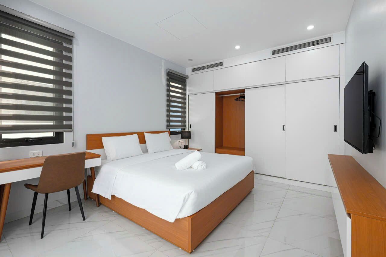 Desk, laptop workspace, blackout drapes, soundproofing