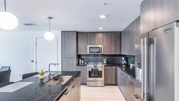 Coffee/tea maker, fridge, microwave, oven