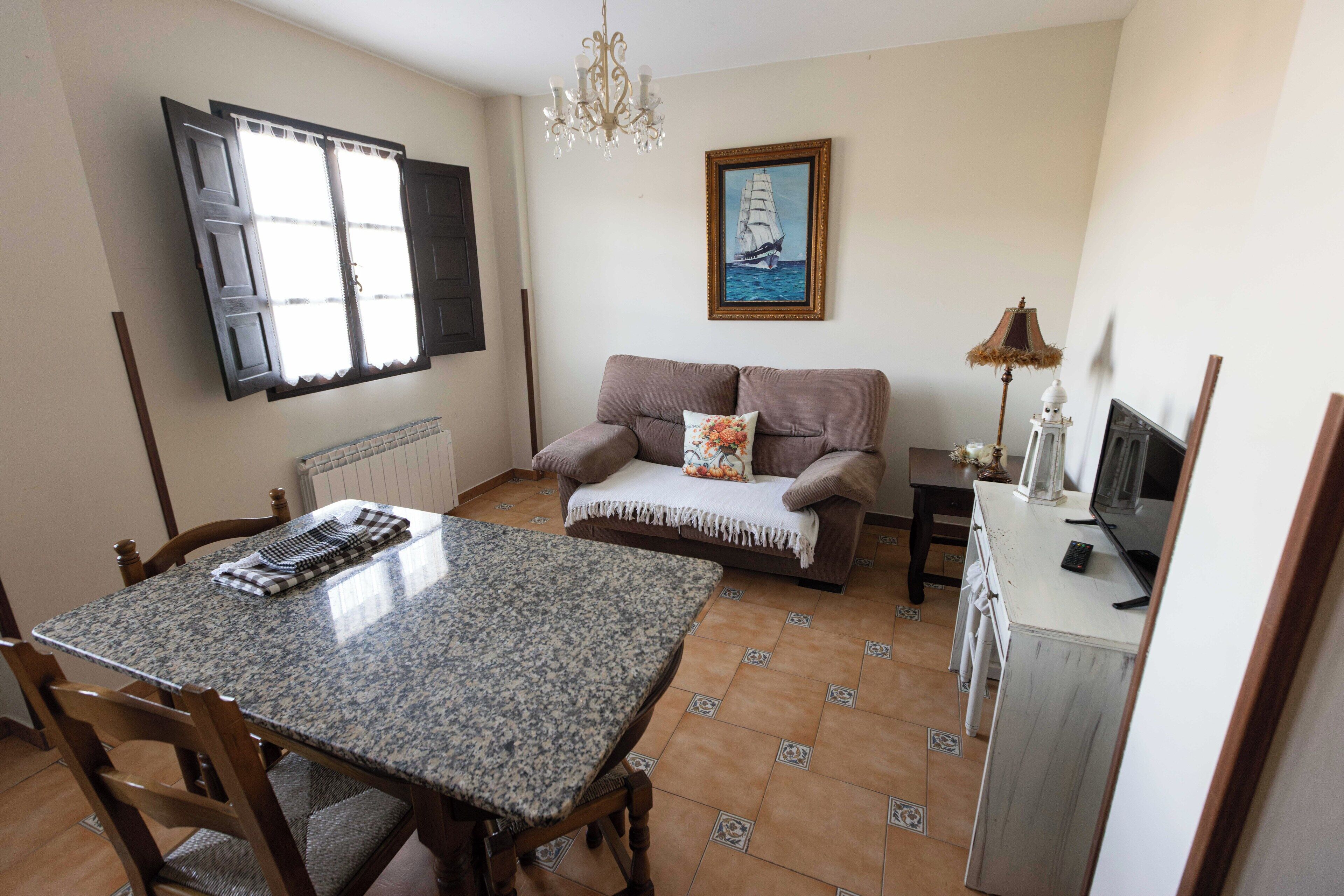 Standaard appartement | Woonruimte | Een televisie