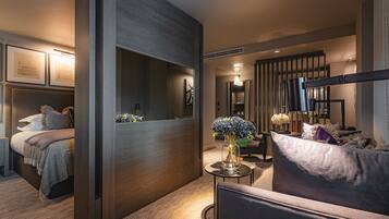 A modern living room with a sofa, a coffee table, and a decorative vase.
