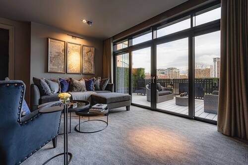 Deluxe Suite | Living area | 58-inch Smart TV with digital channels