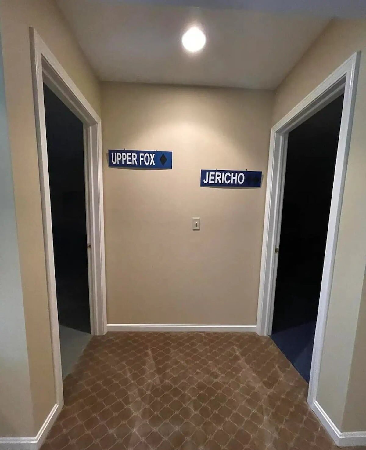 A hallway with two doors labeled "Upper Fox" and "Jericho."