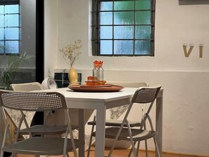 Enjoy meals in this dining area with a table for four, surrounded by comfortable chairs and a beautiful view.