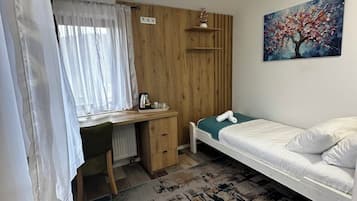 Premium bedding, desk, laptop workspace, iron/ironing board