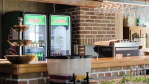 A brick wall with a refrigerator and a sink. - Hotel Citadela (Sarajevo)
