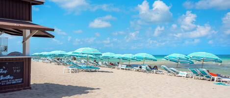 On the beach, sun-loungers, beach towels