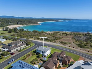 A residential area with houses, a road, and a beach. - Bawley Blue Pet Friendly at Bawley Point (Bawley Point)
