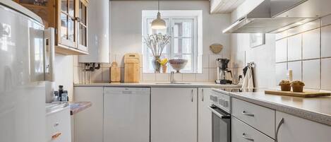 Fridge, stovetop, dishwasher, coffee/tea maker