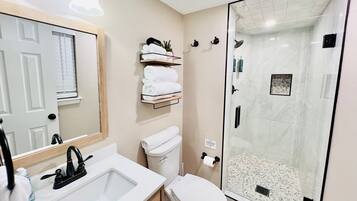 Hair dryer, towels, soap, shampoo