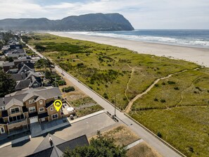 On the beach - Oceanfront Monthly Retreat, Modern Condo with Private Patio, Fire Pit, & Steps to Promenade (Seaside)