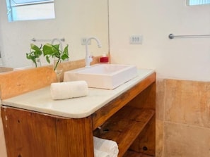 Shower, towels, soap, toilet paper