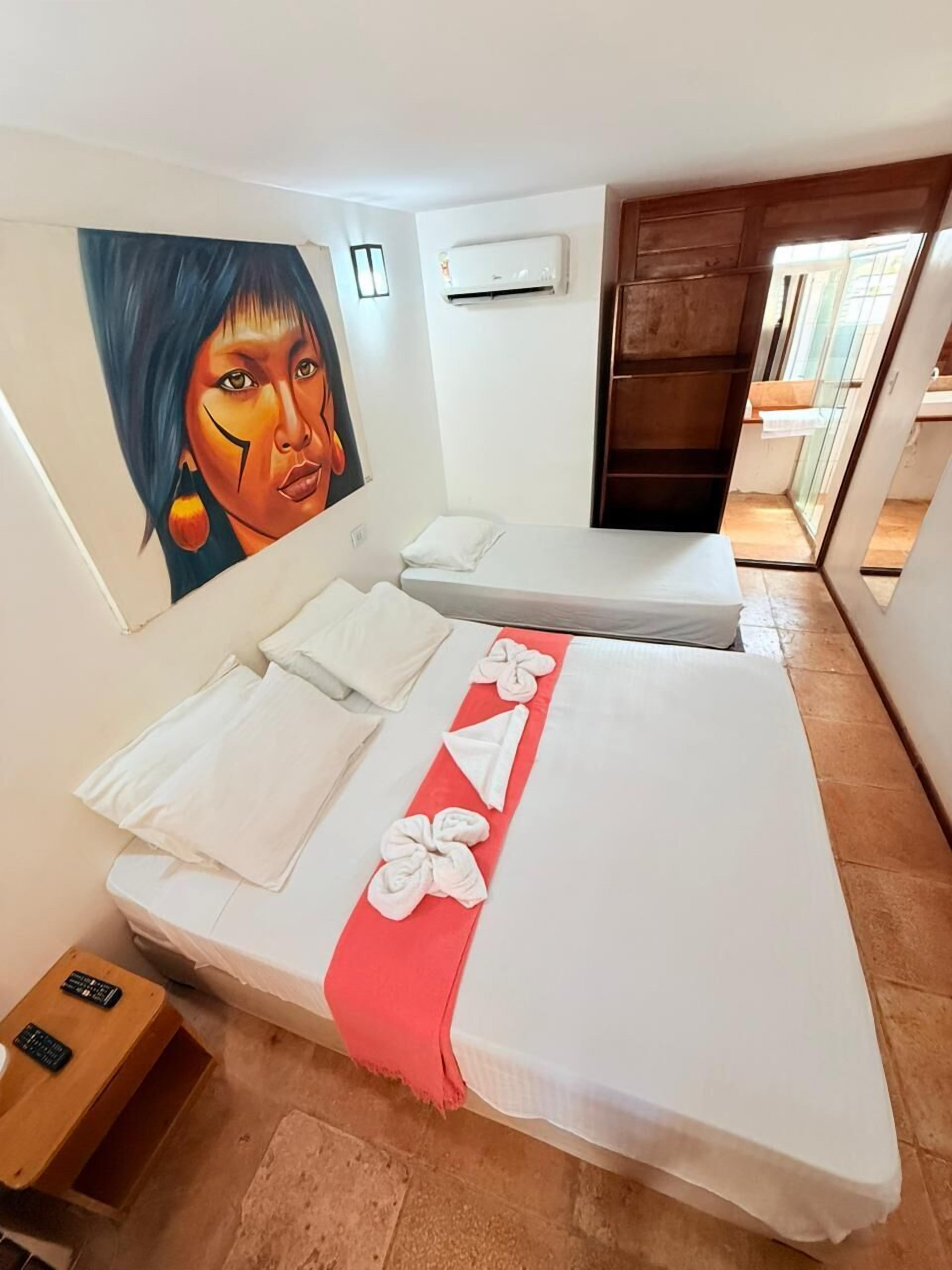 Quarto casal básico, sacada, vista para o jardim | Wi-Fi de cortesia, roupa de cama