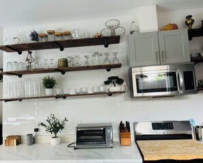Enjoy cooking in this well-equipped kitchen with an oven, microwave, and toaster oven.