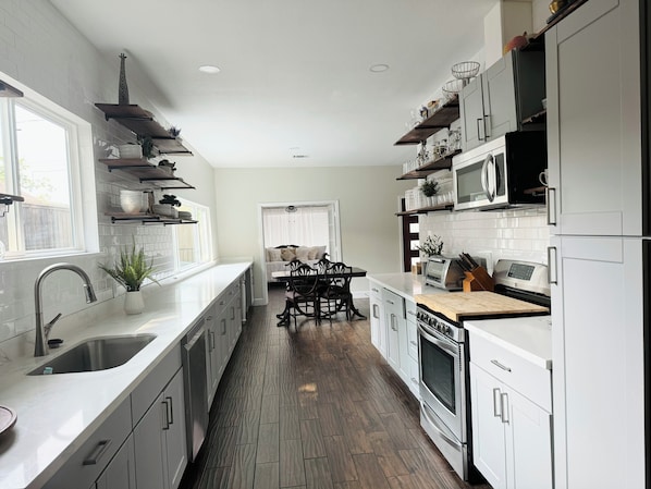 Enjoy meals in the dining area with an oven and microwave nearby.