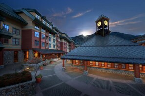 A hotel with a clock tower, multiple buildings, and a paved courtyard. - Luxury 1-Bedroom Marriott's Timber Lodge villa for New Year week special! (South Lake Tahoe)