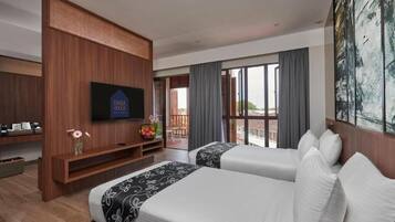 A hotel room with two beds, a TV, a balcony with a view, and a large painting.
