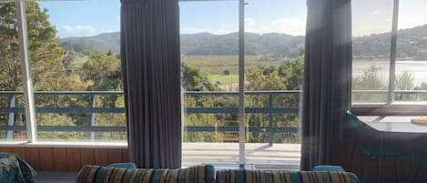 Standard Studio, Sea View | Living area | 40-inch Smart TV with digital channels, streaming services