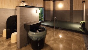 A modern bathroom with a large sink, toilet, and shower area. - Hotel Route Inn Grand Kainan Ekimae (Kainan)