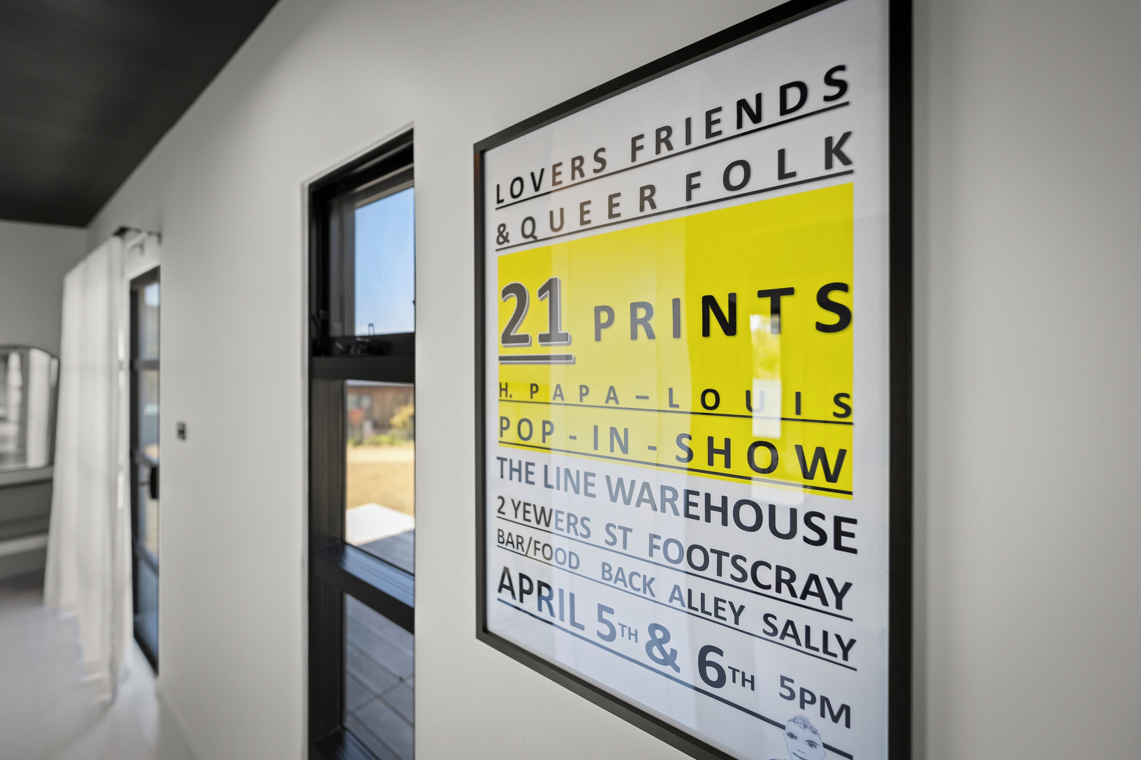 A sign advertising a pop-in show at The Line Warehouse, located at 2 Yewers St, Footscray, with events on April 5th and 6th at 5 PM.