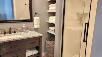 Shower, hair dryer, towels, soap