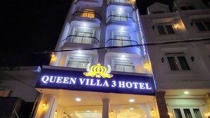 The exterior of Queen Villa 3 Hotel at night, featuring illuminated signage, a grand entrance with steps, and a well-lit facade. - Queen Villa 3 Hotel DL - by Bay Luxury (Xuan Huong - Da Lat)