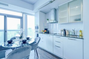 Deluxe Apartment, Balcony, City View | Private kitchen | Full-sized fridge, microwave, oven, stovetop