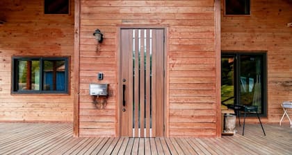 A log house with a 100% natural hot spring.