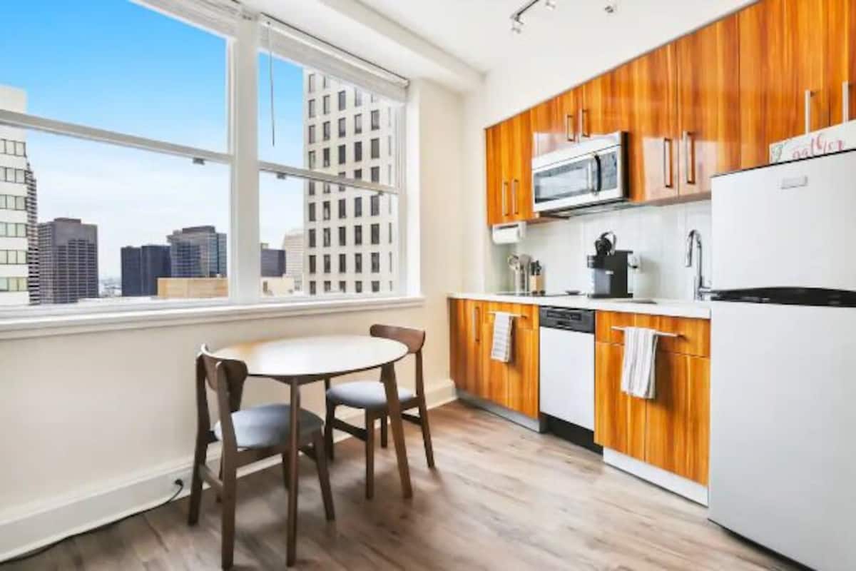Comfort Condo, 1 Queen Bed, Kitchen, City View | Living area | 50-inch Smart TV with digital channels, streaming services