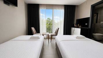 Desk, laptop workspace, free WiFi, bed sheets