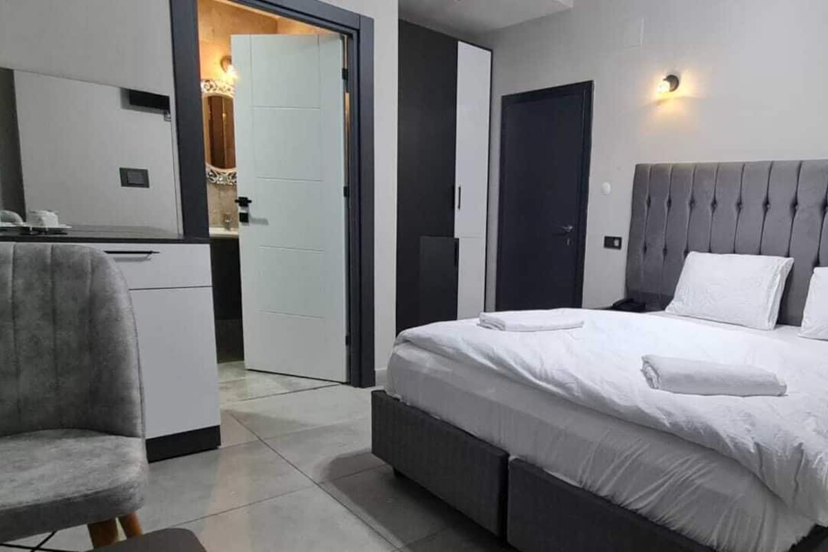 Desk, laptop workspace, free WiFi, bed sheets