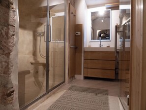 Shower, hair dryer, towels, soap