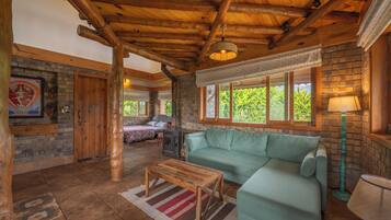 Premium Quadruple Room, Mountain View | Living area | 43-inch flat-screen TV with cable channels