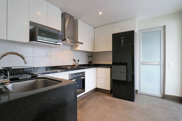 Fridge, microwave, stovetop, coffee/tea maker