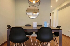 Enjoy meals with family and friends at this dining area, featuring a spacious table and comfortable seating for six.