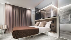 A modern bedroom with a bed, a bedside table, and a large window with curtains. - Karma6Rooms (Catania)