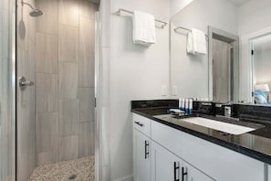 Shower, hair dryer, towels, shampoo