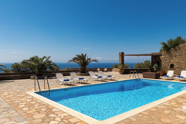 Seasonal outdoor pool, open 9:00 AM to 8:00 PM, pool loungers