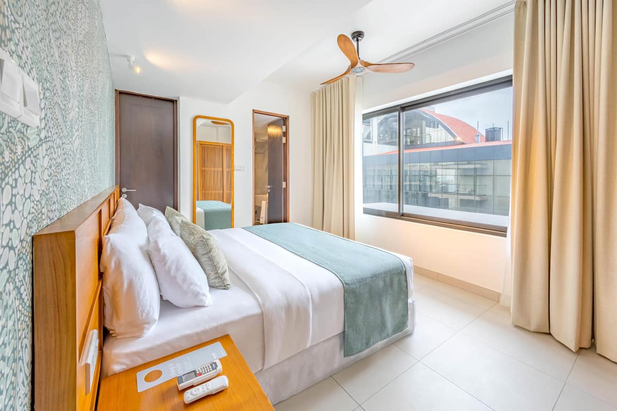 Deluxe Apartment, 3 Bedrooms, City View | Premium bedding, minibar, in-room safe, desk