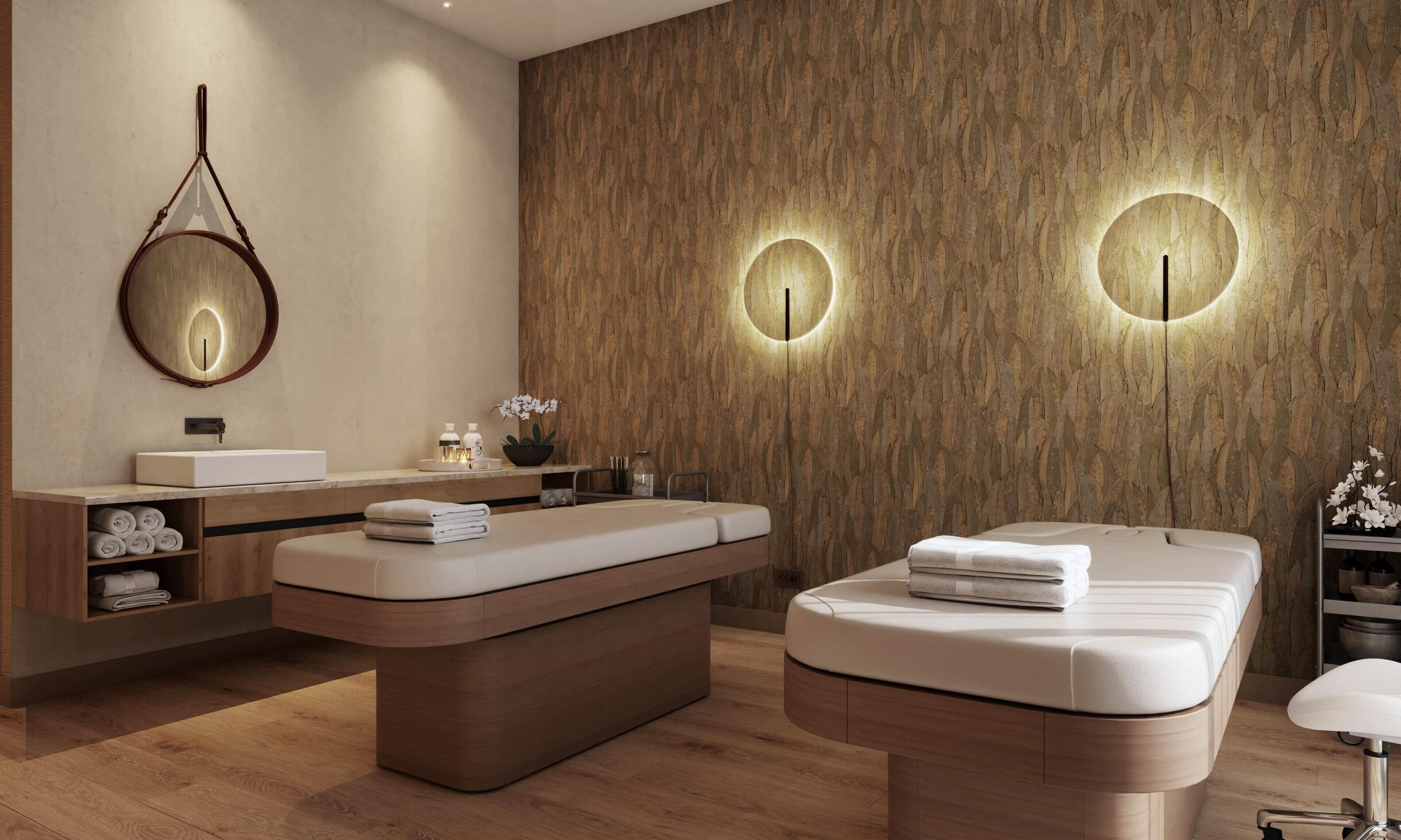 Un spa moderno con pared de madera, un espejo redondo, mostrador de recepción y una camilla de masaje.