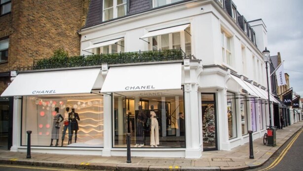 A Chanel store with mannequins displaying clothing. - The Elden - No.3 (London)