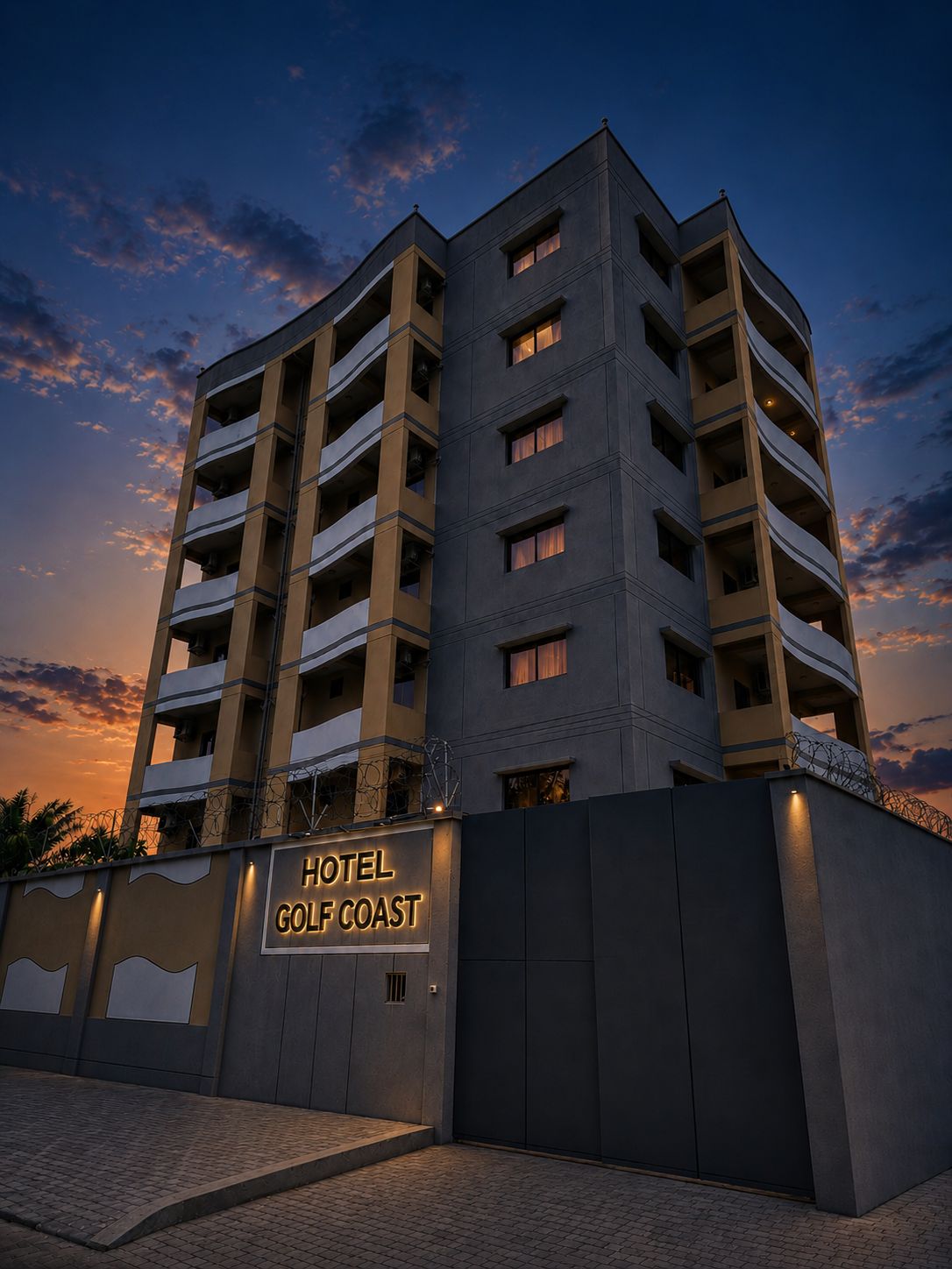 A multi-story hotel with a sign reading 'HOTEL GOLD COAST.'