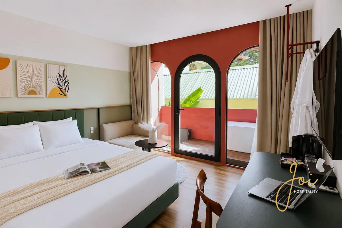 Signature Room | Desk, laptop workspace, blackout curtains, soundproofing