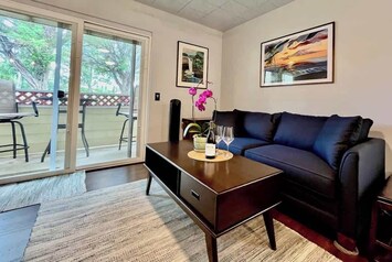 Living Room leads to outdoor lanai with golf course view